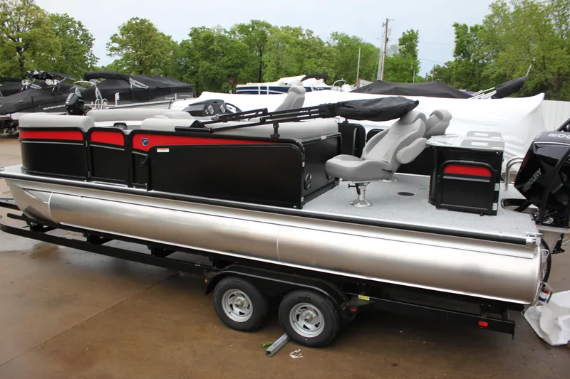 Slide: The Image of 2024 Premier 230 SunSation Angler pontoon boat on trailer, side view. - 16
