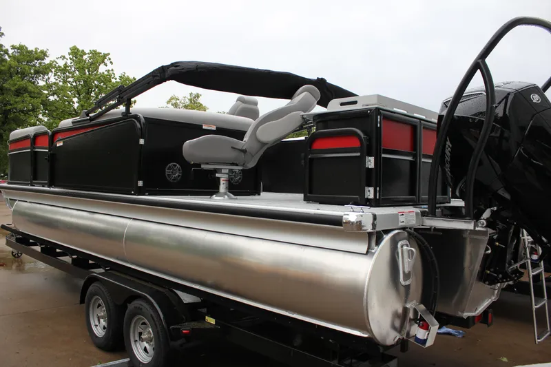 Slide: The Image of 2024 Premier 230 SunSation Angler pontoon boat on trailer, side view. - 18