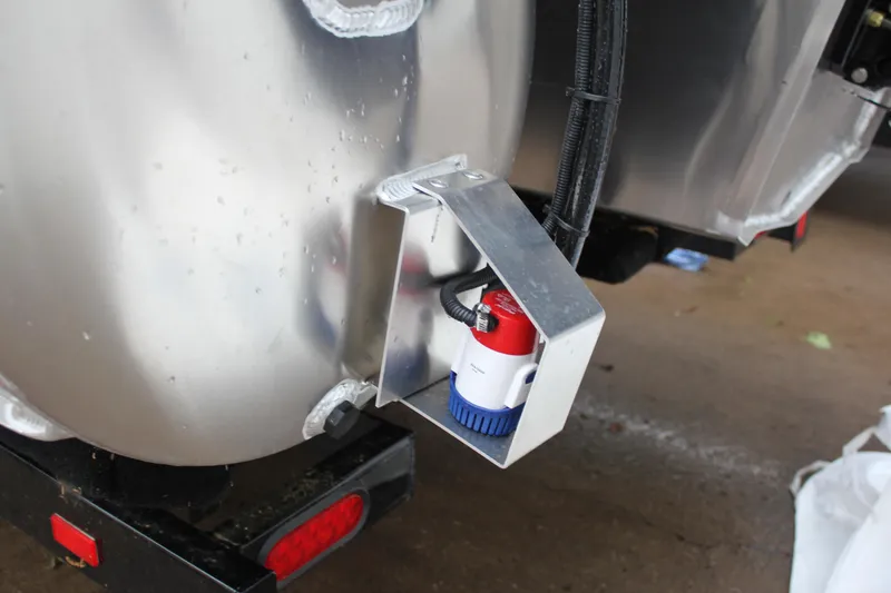 Slide: The Image of Close-up of the 2024 Premier 230 SunSation Angler boat's bilge pump system. - 19