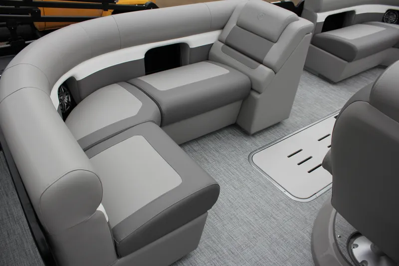 Slide: The Image of 2024 Premier 230 SunSation Angler boat interior with gray and white seating. - 20