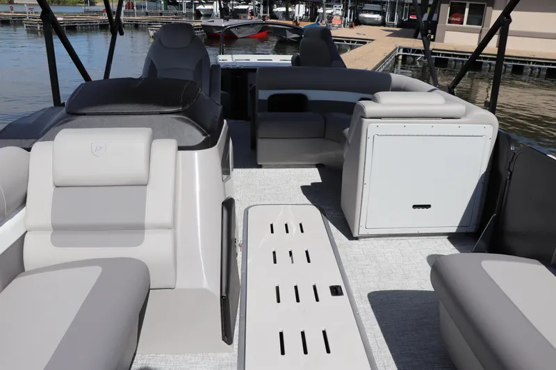 Slide: The Image of 2024 Premier 230 SunSation Angler boat interior with spacious seating and modern design. - 24