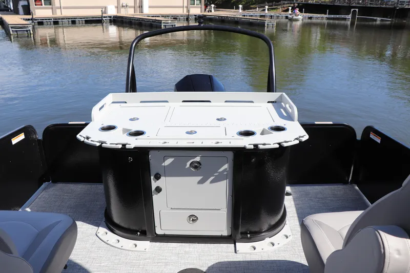 Slide: The Image of 2024 Premier 230 SunSation Angler boat with fishing station on calm water. - 25