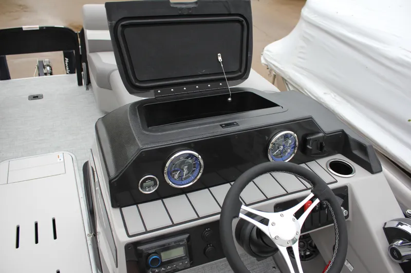 Slide: The Image of 2024 Premier 230 SunSation Angler dashboard with steering wheel and instrument panel. - 30