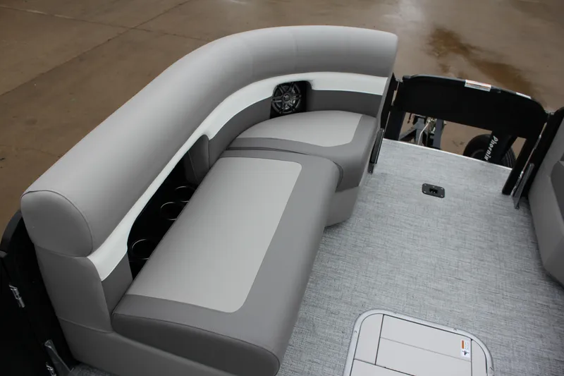Slide: The Image of 2024 Premier 230 SunSation Angler boat interior with gray seating and cup holders. - 32