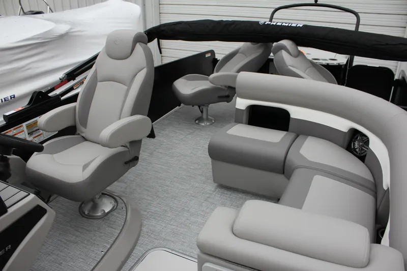 Slide: The Image of 2024 Premier 230 SunSation Angler boat interior with gray seating and modern design. - 33