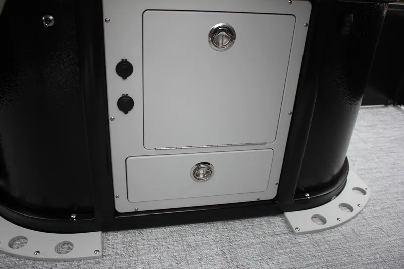 Slide: The Image of 2024 Premier 230 SunSation Angler storage compartment with secure latches and sleek design. - 38