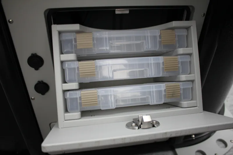 Slide: The Image of Storage compartment with tackle boxes on the 2024 Premier 230 SunSation Angler boat. - 40