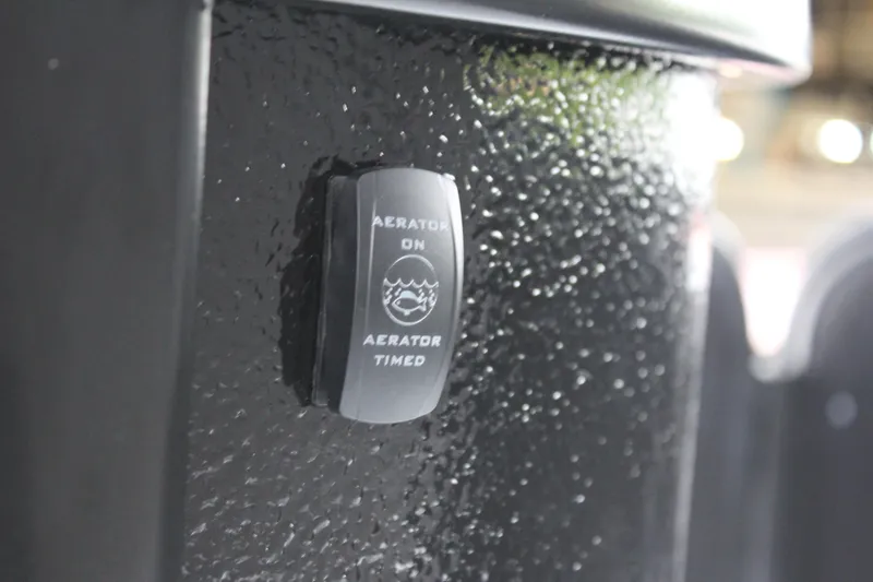 Slide: The Image of Aerator switch on 2024 Premier 230 SunSation Angler boat. - 41