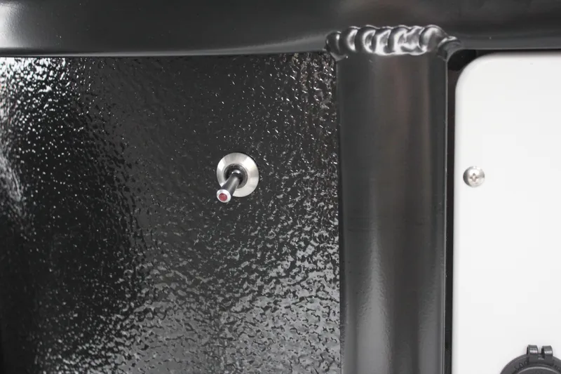 Slide: The Image of Close-up of a switch on the 2024 Premier 230 SunSation Angler boat. - 42