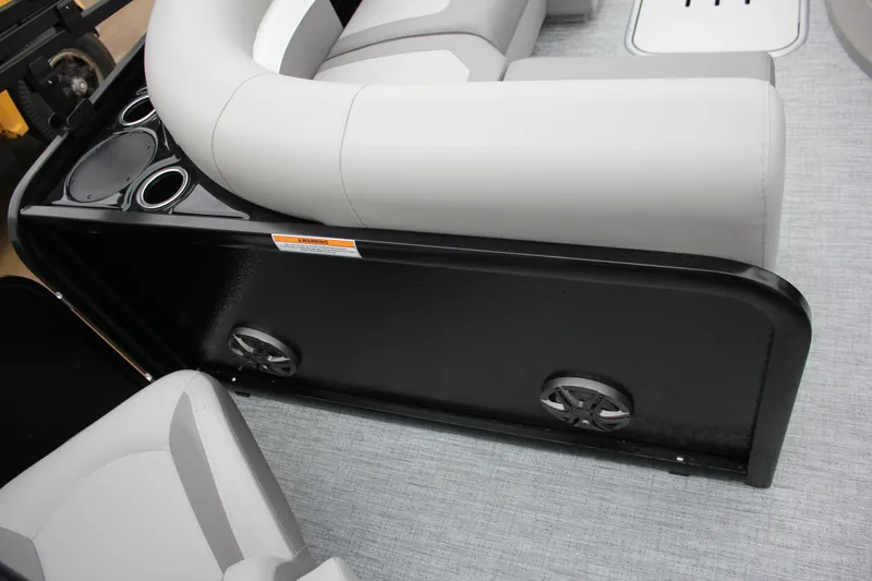 Slide: The Image of 2024 Premier 230 SunSation Angler boat interior with seating and cup holders. - 46