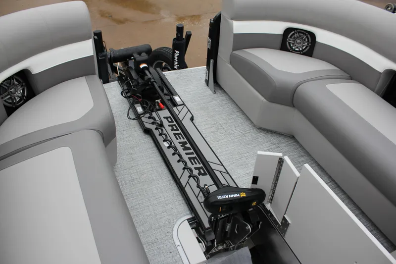 Slide: The Image of 2024 Premier 230 SunSation Angler boat interior with fishing rod storage. - 49