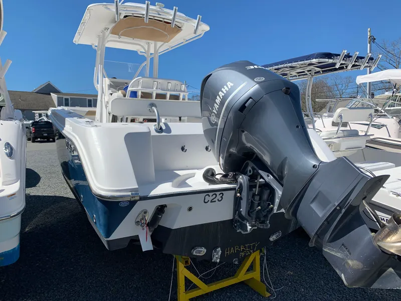 Slide: The Image of 2017 Edgewater 245 CC boat with Yamaha outboard motor in a marina. - 4