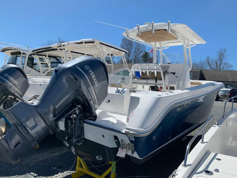 Slide: The Image of 2017 Edgewater 245 CC boat with Yamaha outboard motor in a marina. - 5