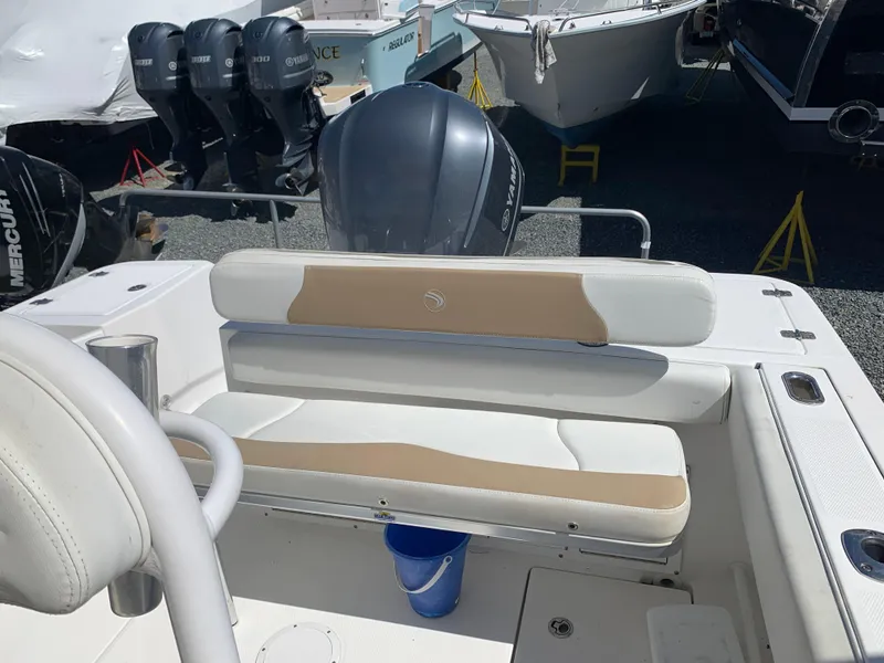 Slide: The Image of 2017 Edgewater 245 CC boat with seating and outboard motor. - 9