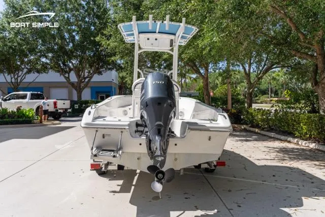 Slide: The Image of 2023 Sea Pro 199 Deep V Center Console boat with outboard motor, parked outdoors. - 3
