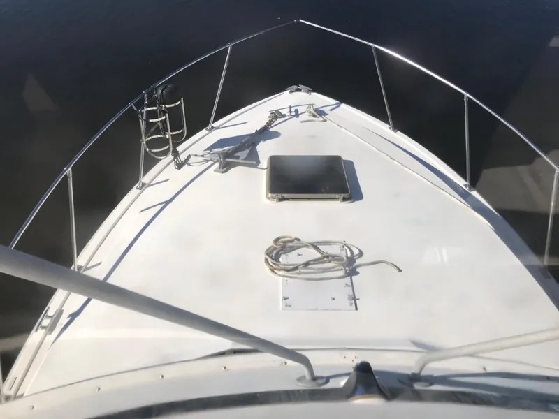Slide: The Image of 1981 Bertram 35 Convertible boat bow with railing and deck equipment. - 11