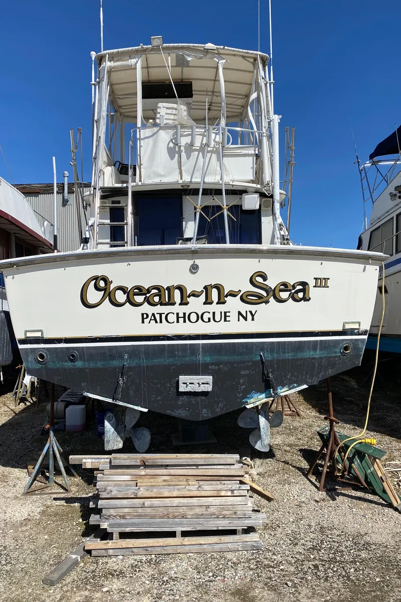 Slide: The Image of 1981 Bertram 35 Convertible boat Ocean-n-Sea in Patchogue, NY, docked on land. - 21