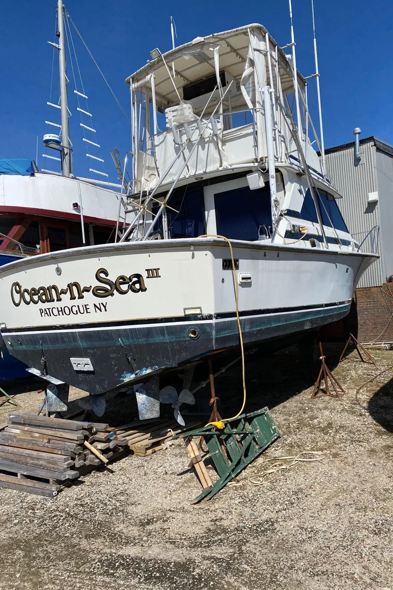 Slide: The Image of 1981 Bertram 35 Convertible boat named Ocean-n-Sea III in Patchogue, NY, on dry dock. - 23