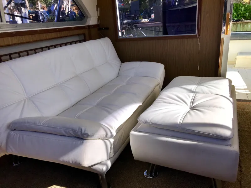 Slide: The Image of Interior of 1981 Bertram 35 Convertible with white leather seating. - 6