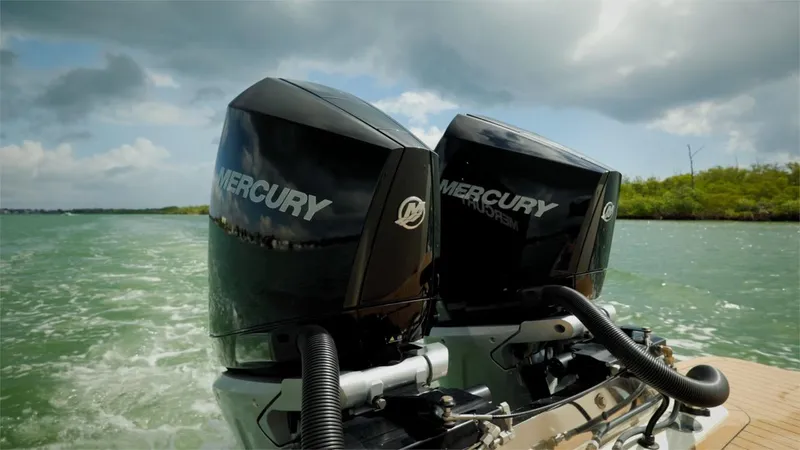 Slide: The Image of Twin Mercury outboard engines on a 2022 Scout 330 LXF boat. - 15