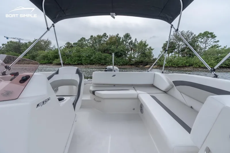 Slide: The Image of 2022 Starcraft SVX 171 OB boat interior with seating and canopy. - 8