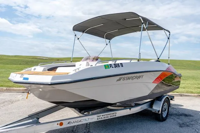 Slide: The Image of 2022 Starcraft SVX 171 OB boat on trailer with canopy. - 16