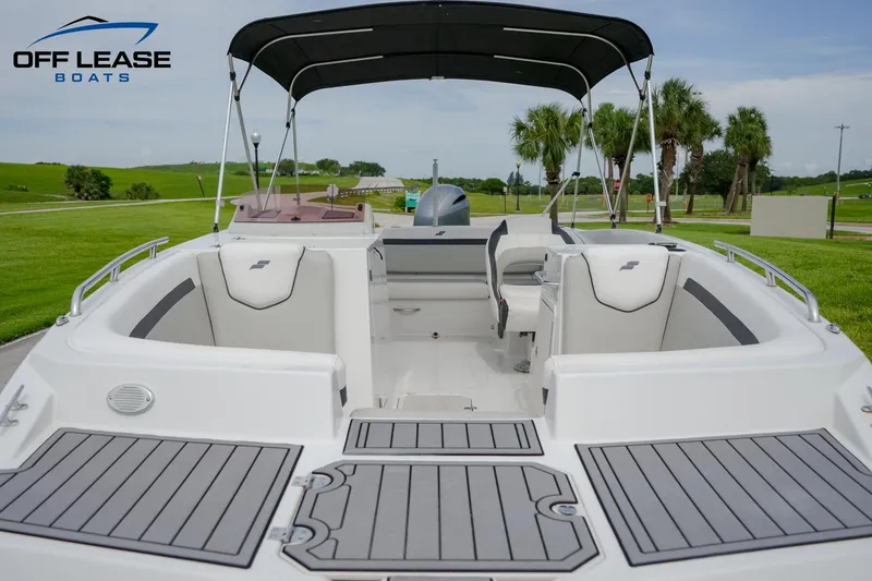 Slide: The Image of 2022 Starcraft SVX 231 OB boat with spacious seating and canopy. - 11