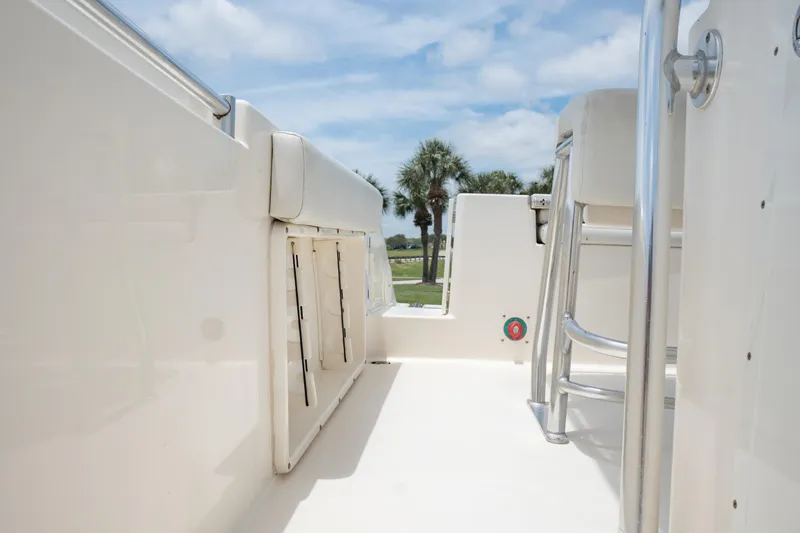 Slide: The Image of 2021 Cobia 201 Center Console boat interior with seating and storage compartments. - 12
