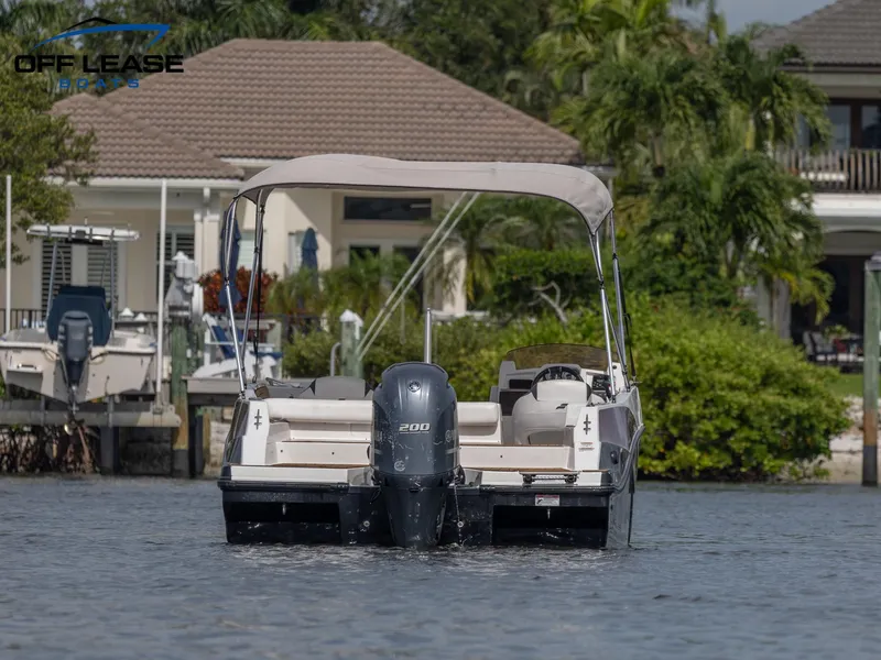 Slide: The Image of 2021 Starcraft SVX 231 OB boat on water near waterfront homes. - 4