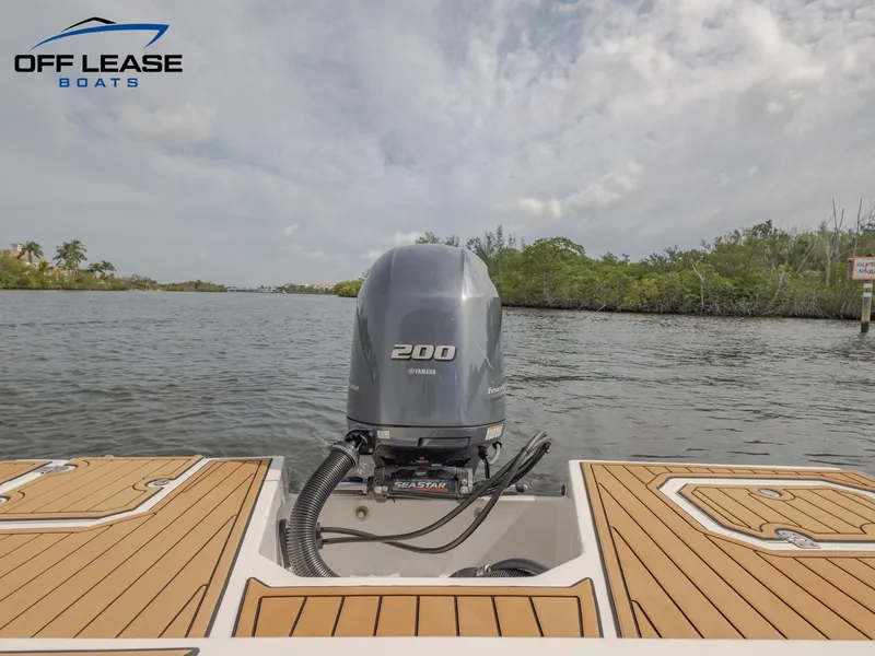 Slide: The Image of 2021 Starcraft SVX 231 OB boat with Yamaha 200 outboard motor on water. - 6