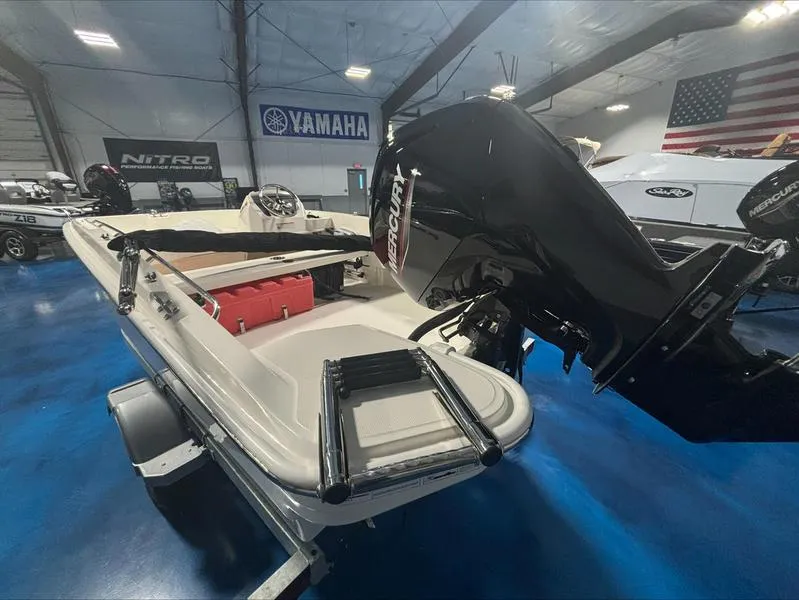 Slide: The Image of 2025 Boston Whaler 160 Super Sport boat with Mercury engine in showroom. - 3