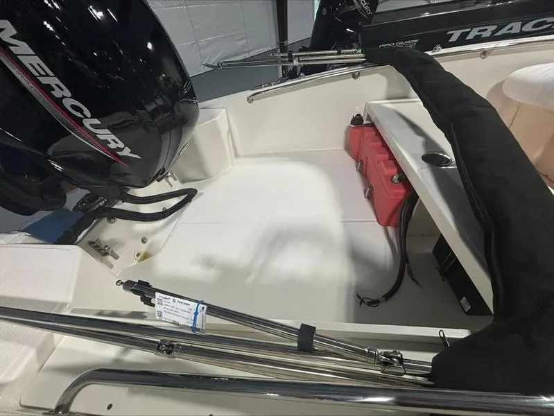 Slide: The Image of 2025 Boston Whaler 160 Super Sport boat interior with Mercury engine. - 5