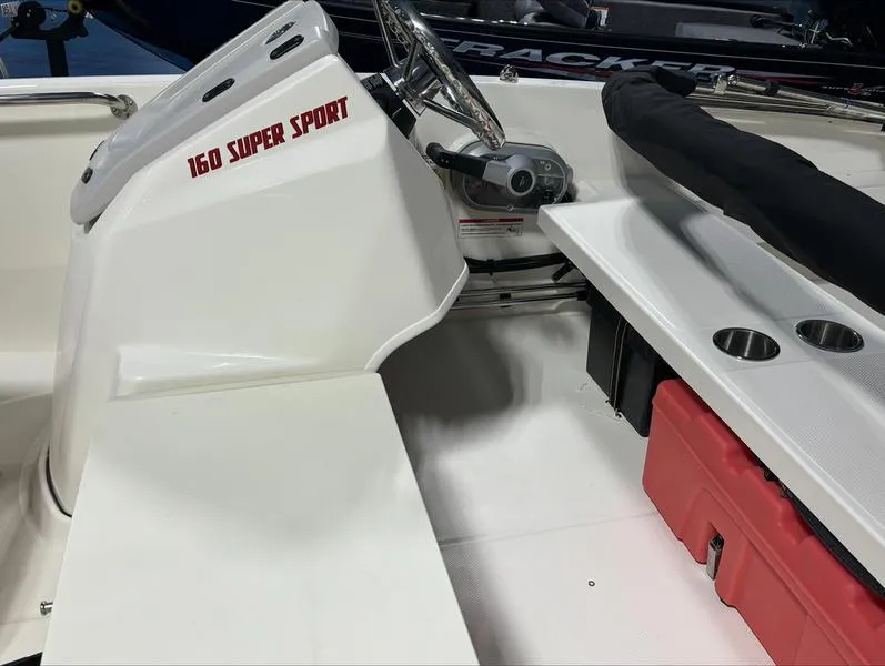 Slide: The Image of 2025 Boston Whaler 160 Super Sport interior with steering console and seating area. - 9