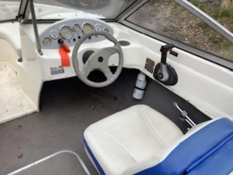 Slide: The Image of 2006 Bayliner 175 BR boat cockpit with steering wheel and control panel. - 3