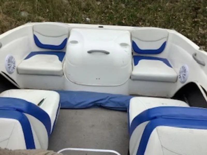 Slide: The Image of 2006 Bayliner 175 BR boat interior with blue and white seating. - 4