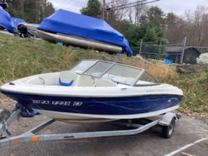 Slide: The Image of 2006 Bayliner 175 BR boat on a trailer, parked outdoors. - 5