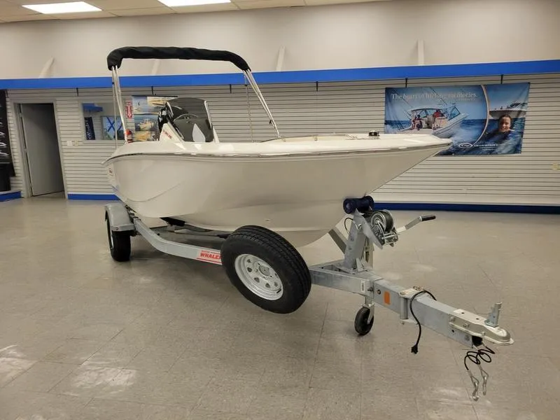 Slide: The Image of 2025 Boston Whaler 160 Super Sport boat on trailer in showroom. - 3