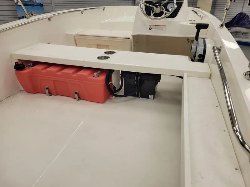 Slide: The Image of 2025 Boston Whaler 160 Super Sport interior with steering console and fuel tank. - 7