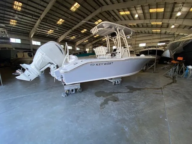 The Image of 2024 Key West 239 FS boat in a spacious indoor storage facility. - 0