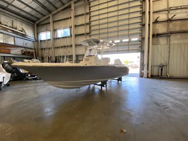 Slide: The Image of 2024 Key West 239 FS boat in a spacious indoor storage facility. - 3