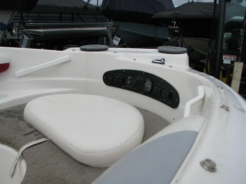Slide: The Image of 1999 Glastron 175SX boat interior with seating and control panel. - 11