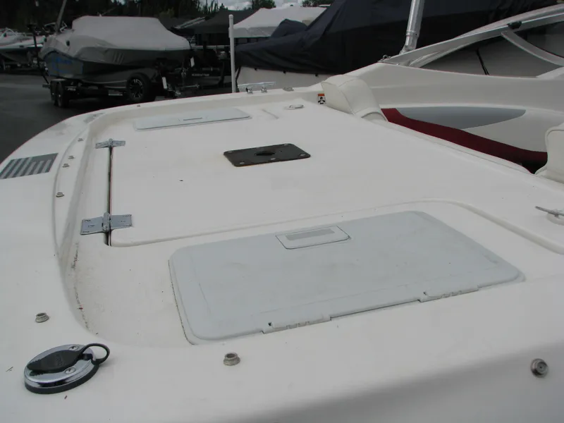 Slide: The Image of 1999 Glastron 175SX boat deck with storage compartments. - 12