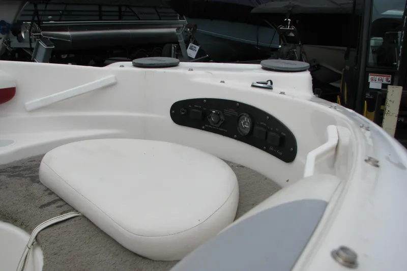 Slide: The Image of 1999 Glastron 175SX boat interior with seating and control panel. - 14