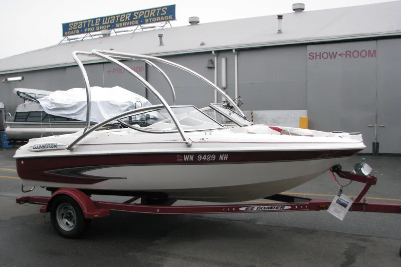 Slide: The Image of 1999 Glastron 175SX boat on trailer at Seattle Water Sports showroom. - 7