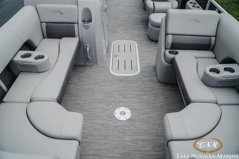 Slide: The Image of 2023 Bennington 23LSR pontoon boat interior with plush seating and cup holders. - 10