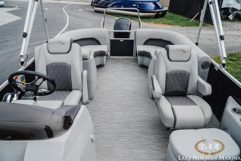 Slide: The Image of 2023 Bennington 23LSR pontoon boat interior with luxurious seating at Lake Norman Marina. - 11
