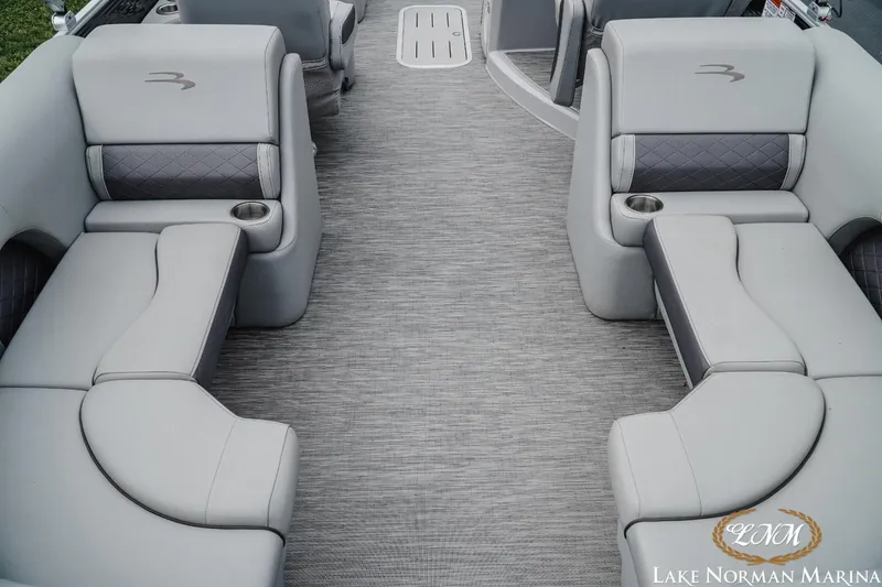Slide: The Image of 2023 Bennington 23LSR boat interior with gray seating and flooring. - 5