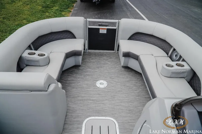 Slide: The Image of 2023 Bennington 23LSR pontoon boat interior with plush seating and cup holders. - 9