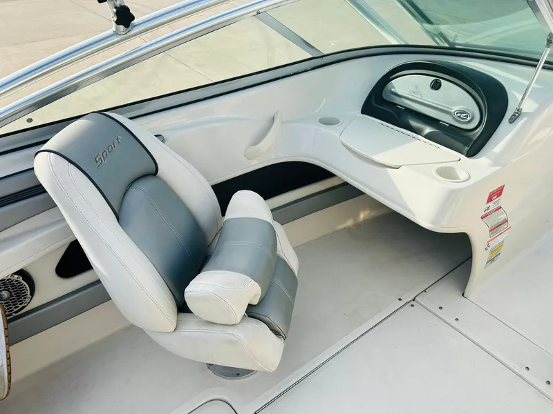 Slide: The Image of 2008 Sea Ray 205 Sport boat interior with gray and white seating and dashboard. - 20