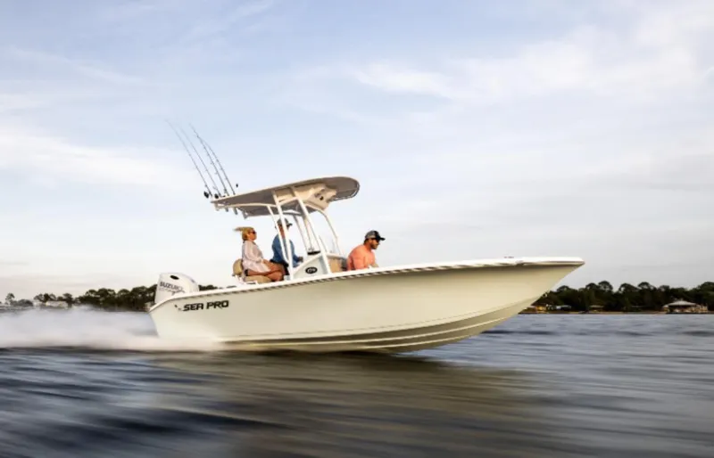 Slide: The Image of 2024 Sea Pro 202 Center Console boat speeding on water. - 6